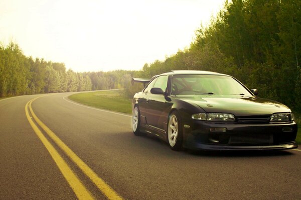 Black sports car on asphalt