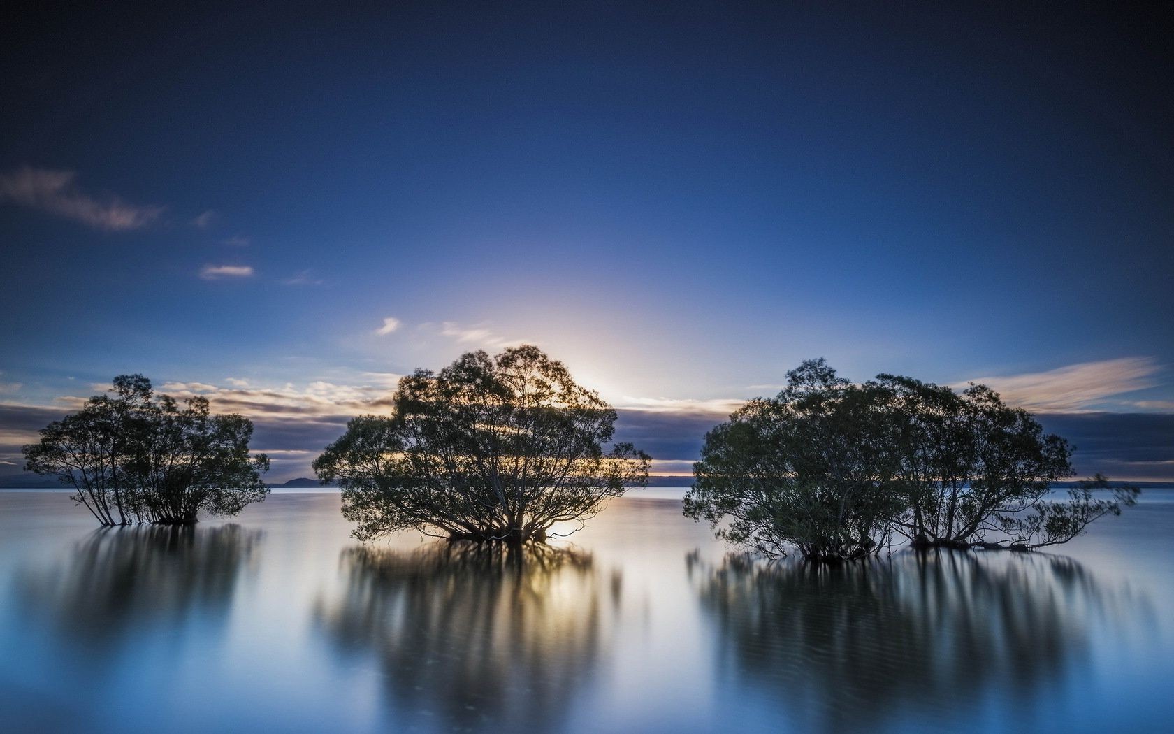 lake water sunset dawn sky dusk reflection evening beach travel sun nature sea outdoors ocean landscape summer