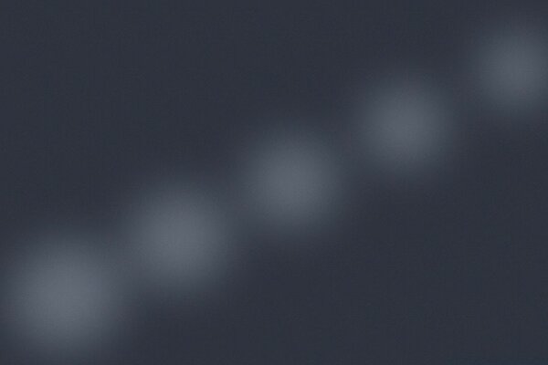 Blurry image of white circles