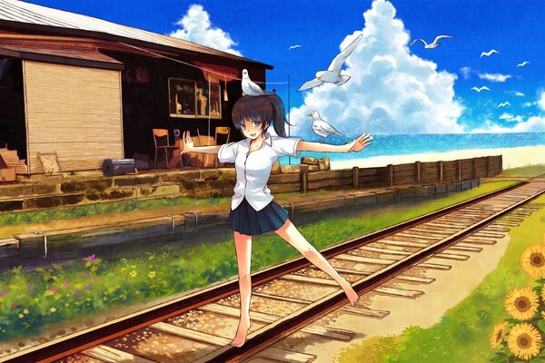 A girl walks on the railway
