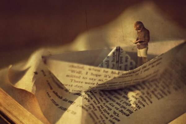 A child reading a book on a boat