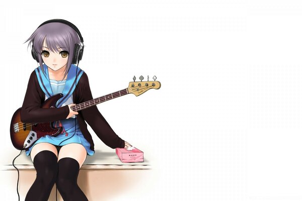 मोबाइल फोनों के लिए लड़की एक इलेक्ट्रॉन गिटार निभाता है