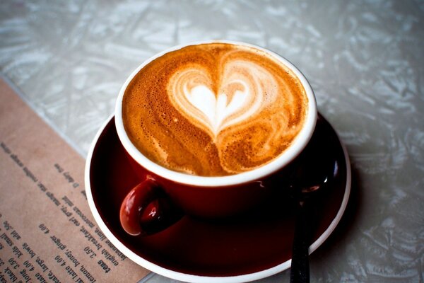 A heart in a cup of coffee. Perfect morning. Beautiful tea pair