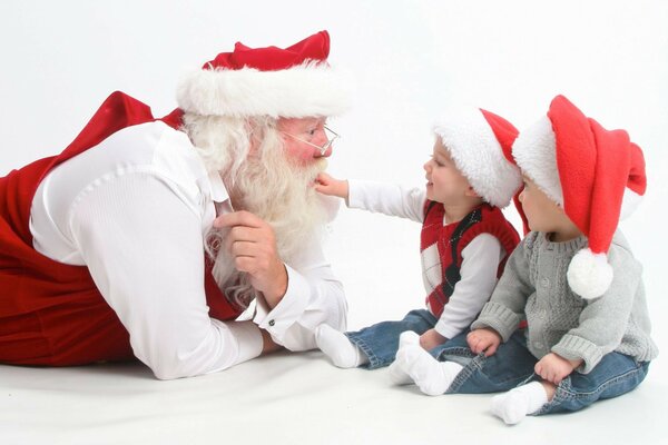 Santa Claus with two kids