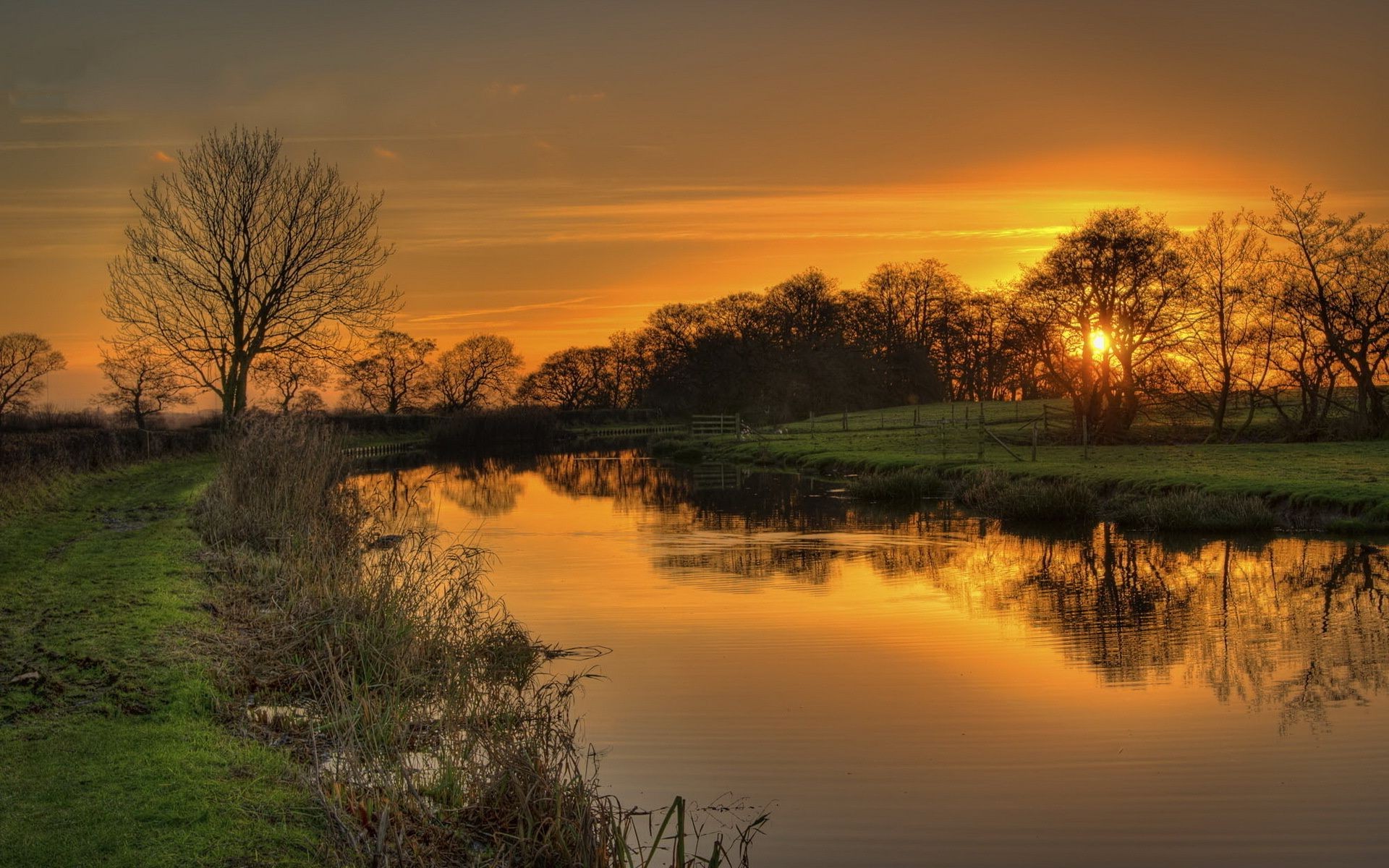 the sunset and sunrise sunset dawn landscape water lake nature reflection tree evening sun sky river fall dusk fair weather fog mist outdoors early