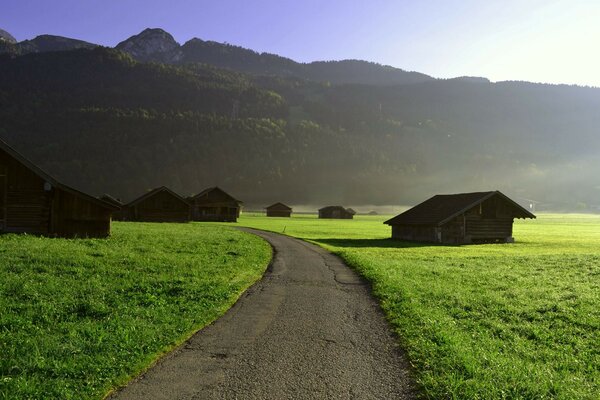 Huts of local residents on alpine meadows