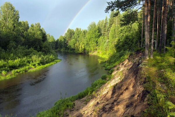 Rainbow in the sky near the river