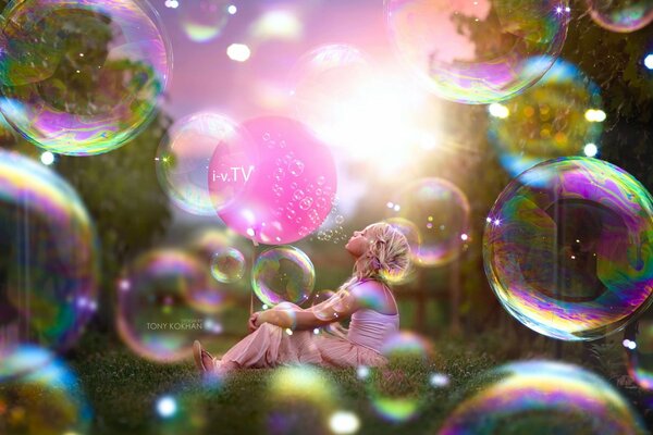 Girl on the background of soap bubbles