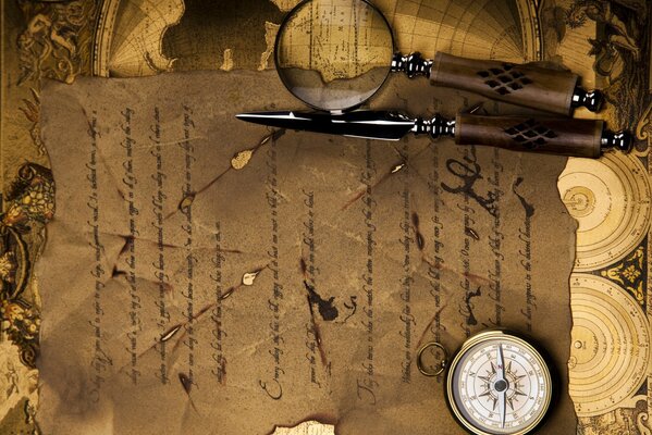 Retro photography. Compass, magnifying glass and old letter