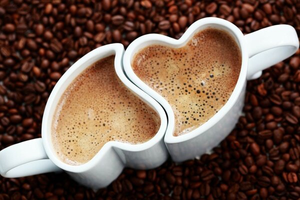 Coffee in mugs in the form of paired hearts