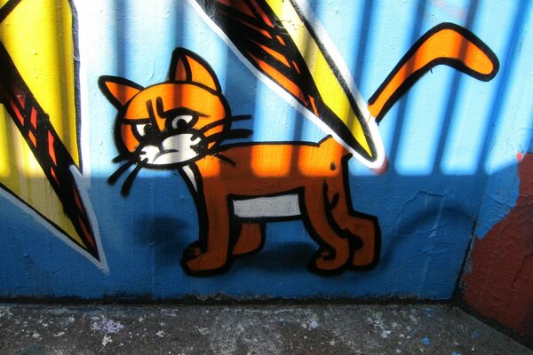 A painted cat on the garage