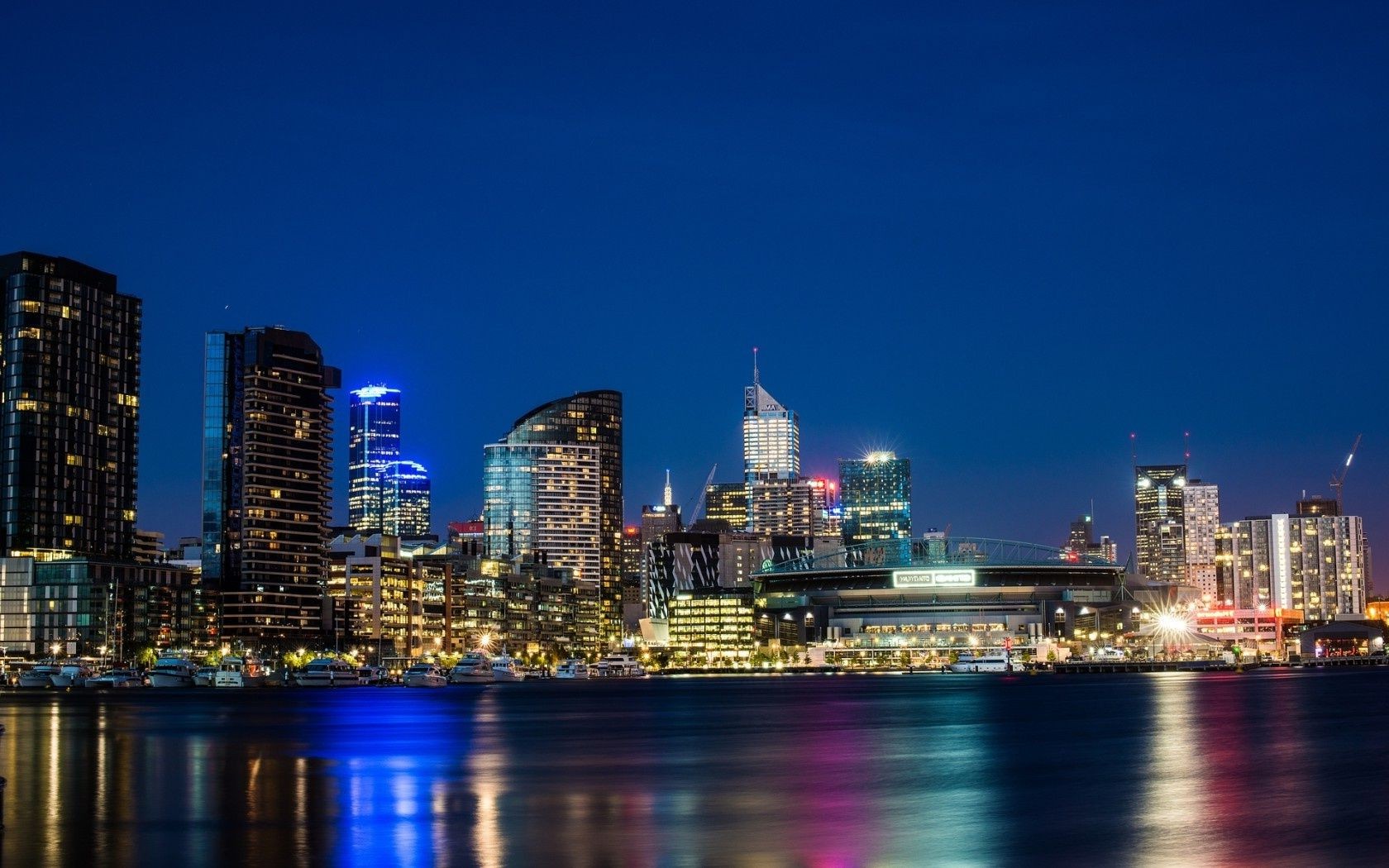 city downtown skyline cityscape skyscraper architecture dusk office travel waterfront building sunset sky water river reflection finance illuminated evening