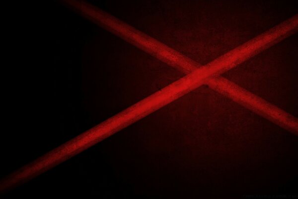 On a dark background, red lines intersect