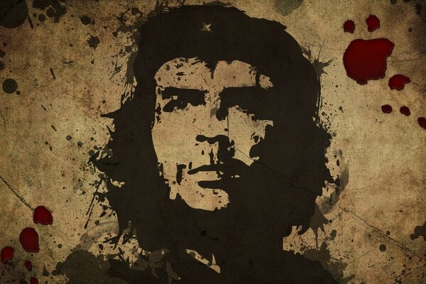 Portrait de Comandante Che Guevara stylisé comme un graffiti peint grossièrement sur un mur de béton