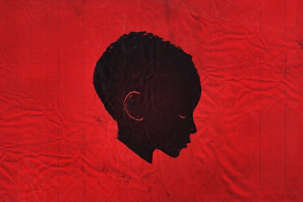 A child s head on a red background