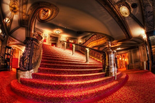 An ornate hotel with a red carpet