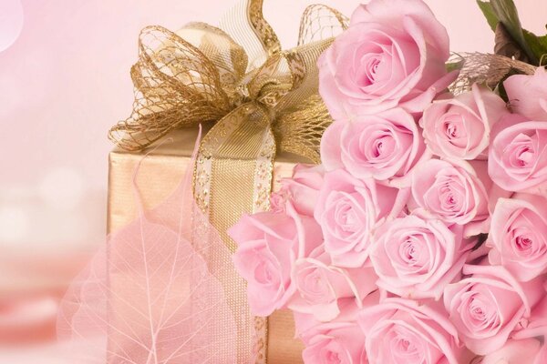 Bouquet of roses with a gift