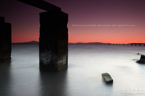 Beautiful sunrise on the sea and rocks