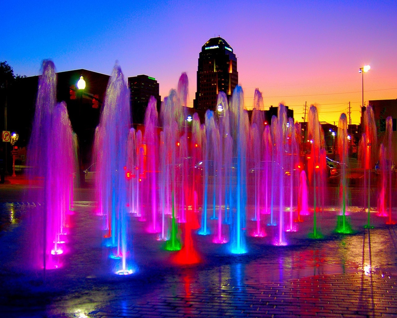 fountains evening illuminated dusk downtown city light architecture reflection