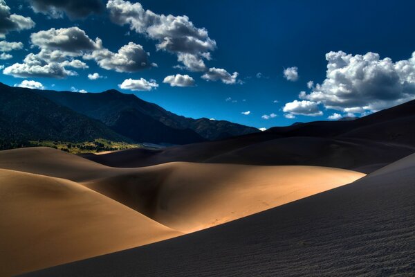 Cloudy skies and desert sand hills