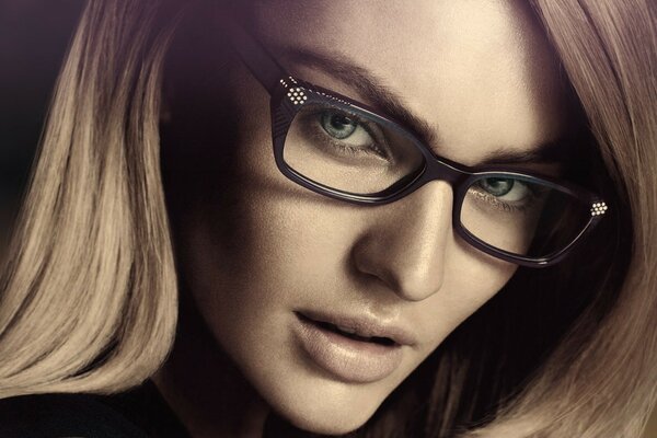 A business girl. Model. Blonde with glasses. Portrait