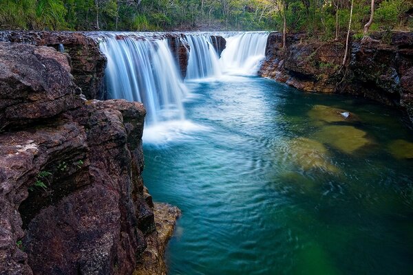 Waterfalls flow down huge rocks