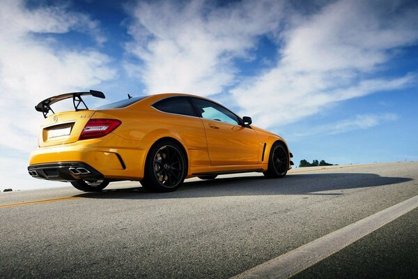 Yellow sports car on the highway