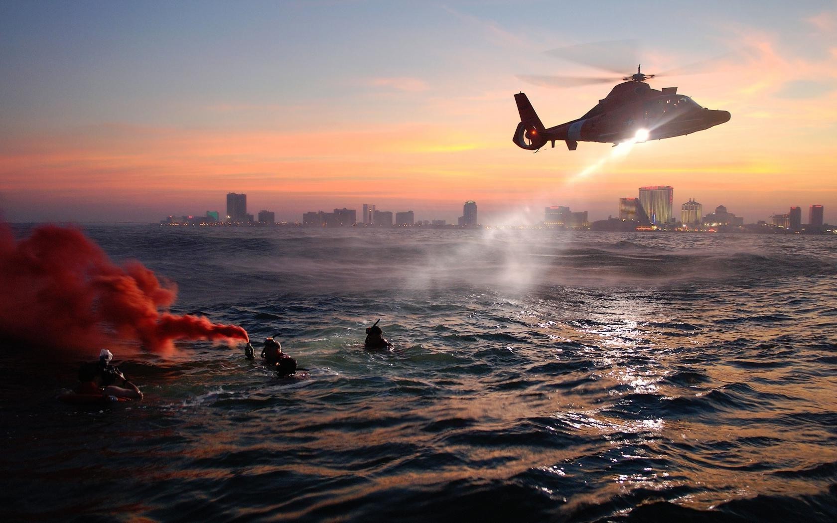 helicopters sunset water dawn ocean evening sea beach watercraft dusk seashore sun surf outdoors water sports travel backlit action