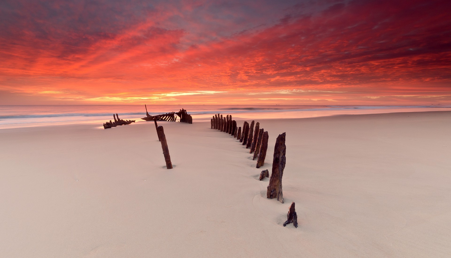 the sunset and sunrise beach water seashore sand ocean sea sunset dawn landscape travel sun winter sky seascape evening