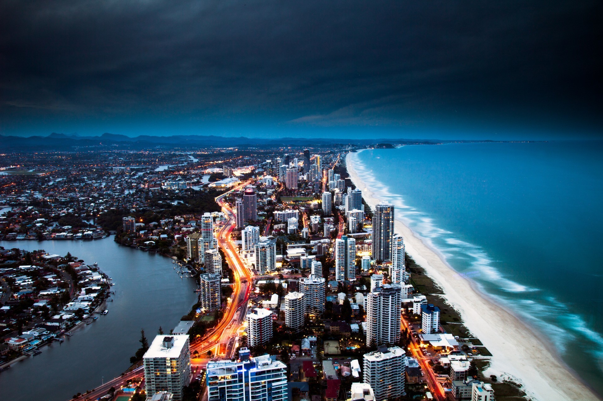 city travel water architecture cityscape sea seashore harbor sky outdoors skyline sunset dusk bay