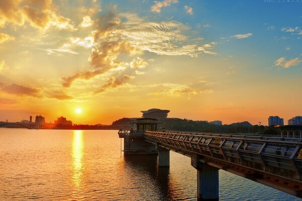 Dawn by the water on the embankment on a journey