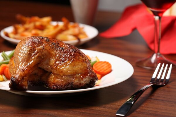 Plate of fried chicken with vegetables