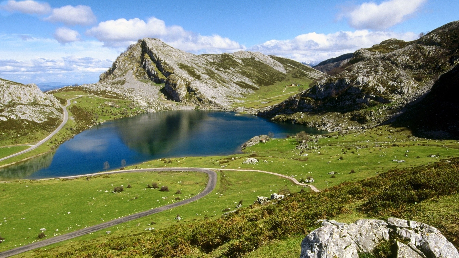 mountains landscape mountain travel outdoors nature sky water scenic snow valley summer grass lake mountain peak hill rock tourism