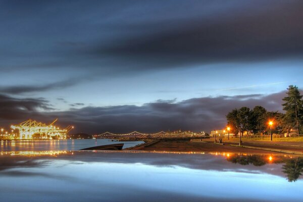 The architecture of the city and the reflection of the sunset in the water