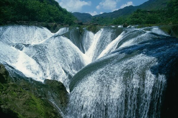 Cascade of waterfalls among the mountains