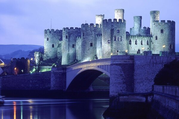 An unusual evening castle with a bridge