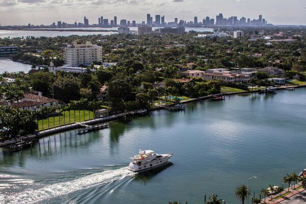 A pleasure ship sails along the canal