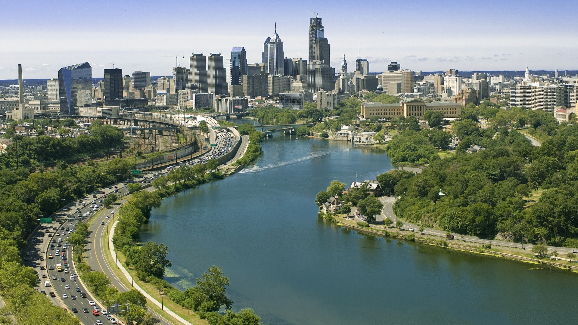 city architecture river water travel outdoors building sky daylight skyline cityscape tree bridge reflection