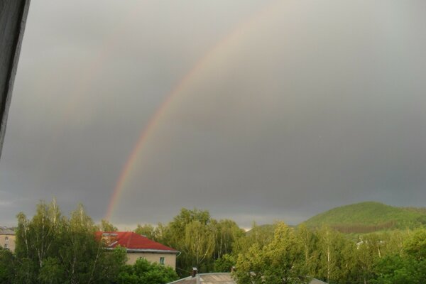 Rainbow over the city after the rain