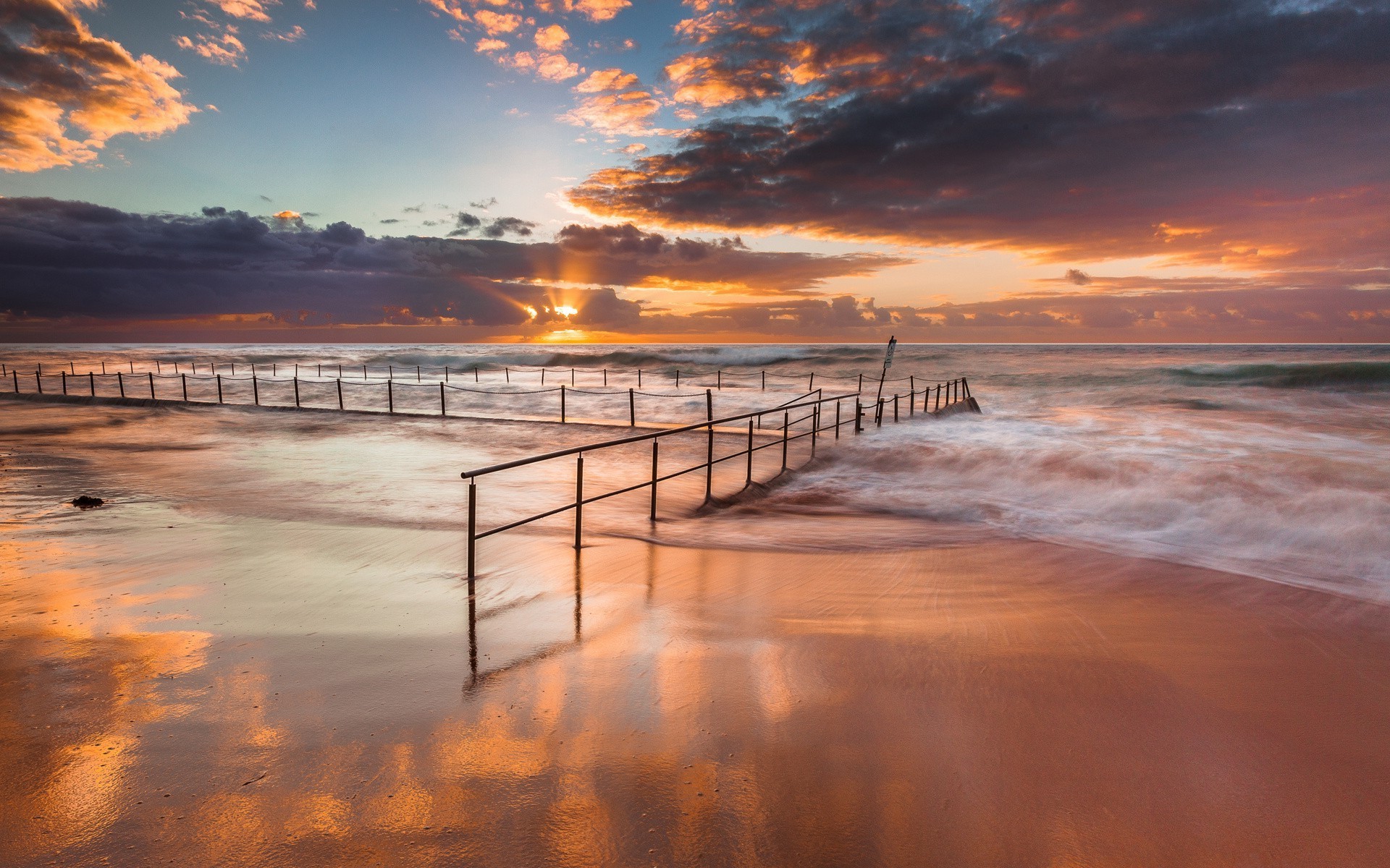 sea and ocean sunset beach water dawn ocean sea sun dusk seashore sand seascape evening travel pier sky reflection jetty cloud landscape summer