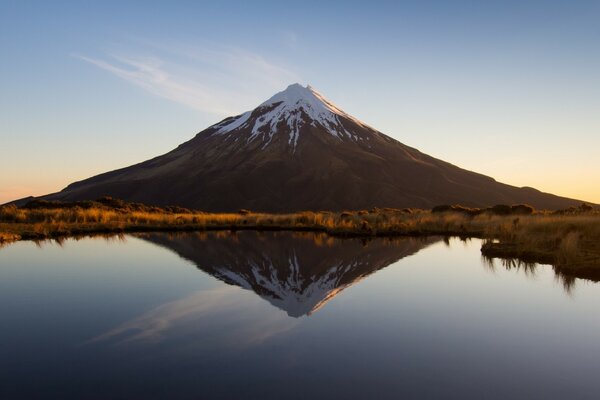 Reflection of a volcano in a crystal lake