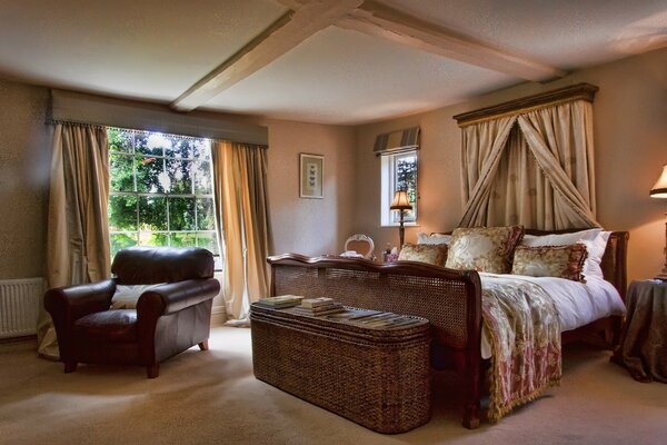 Beautiful bedroom with wicker furniture