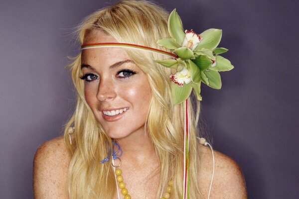 Blonde girl with a wreath of flowers in her head