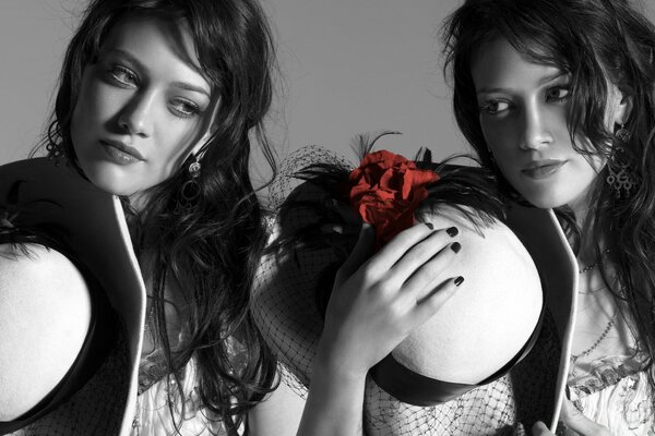 Twin girls posing for a photographer