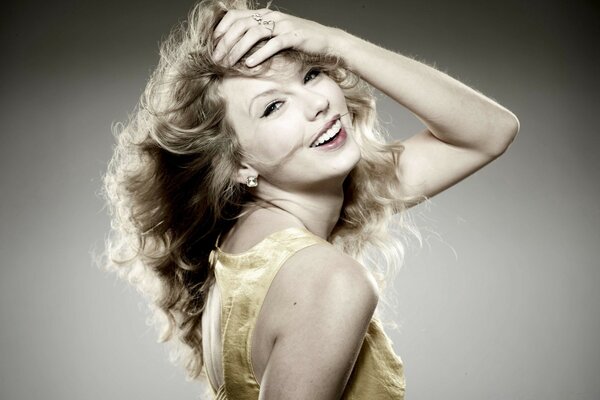 A girl with wavy hair poses for the camera