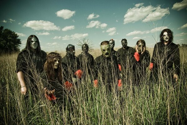 A gang of masked cannibals in a field