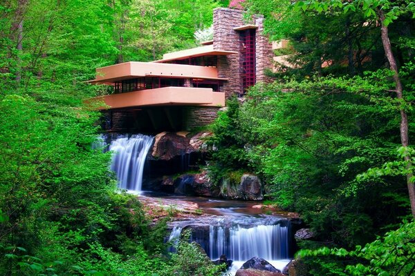 The house next to the waterfall is modern