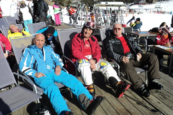 Tourists on sun beds at a ski resort