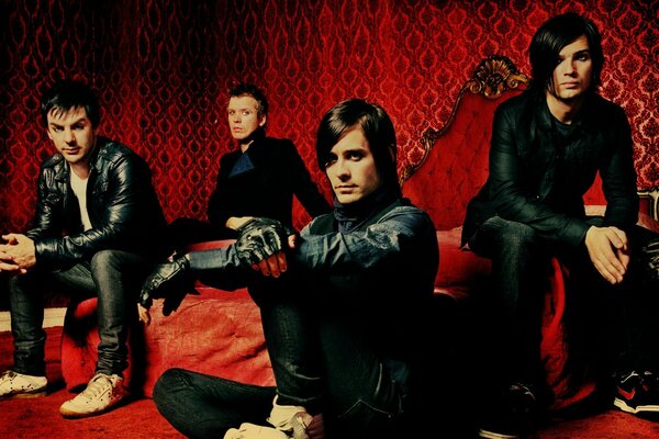 Four guys in leather jackets in the red room