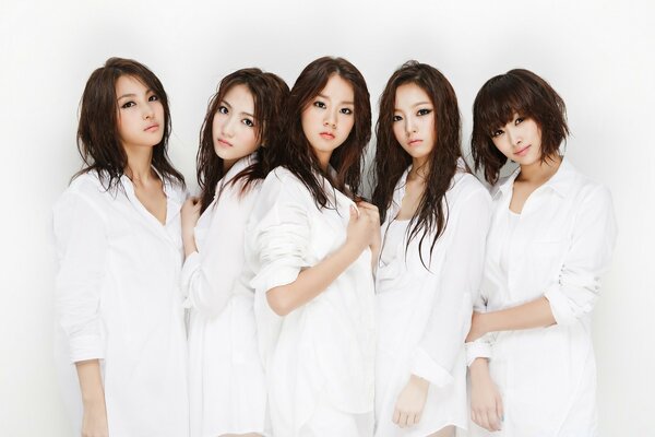 Korean female pop group in white attire